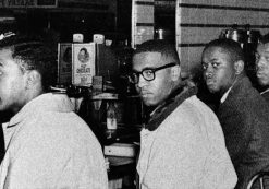 On the second day of the Greensboro sit-in, Joseph A. McNeil and Franklin E. McCain are joined by William Smith and Clarence Henderson at the Woolworth lunch counter in Greensboro, North Carolina. (Courtesy of Greensboro News and Record)