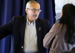 John Podesta, Campaign Manager, left, speaking to senior advisor Huma Abedin on the Hillary Clinton campaign plane from New York enroute to Miami, October 11, 2016. (Photo: Lucy Nicholson/REUTERS)