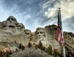 Mount Rushmore National Memorial is a sculpture carved into the granite face of Mount Rushmore, a granite batholith formation in the Black Hills in Keystone, South Dakota, United States. Sculpted by Gutzon Borglum and his son, Lincoln Borglum, Mount Rushmore features 60-foot (18 m) sculptures of the heads of four United States presidents: George Washington (1732–1799), Thomas Jefferson (1743–1826), Theodore Roosevelt (1858–1919), and Abraham Lincoln (1809–1865).