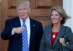 President-elect Donald Trump calls out to the media as he and Betsy DeVos pose for photographs at Trump National Golf Club Bedminster clubhouse in Bedminster, N.J., Saturday, Nov. 19, 2016. (Photo: AP)