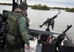 Texas state troopers prepare to launch a gun boat into the Rio Grande that separates the U.S. from Mexico in McAllen, Texas, on Tuesday, November 25, 2014. The troopers patrol the river all day to catch illegal immigrants attempting to cross the border.