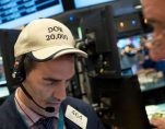 Gregory Rowe follows stock prices at the New York Stock Exchange, Wednesday, Dec. 21, 2016, in New York. The Dow is close to the 20,000 mark. (Photo: AP)