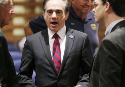 FILE - In this Dec. 14, 2015, file photo, U.S. Department of Veterans Affairs for Health Undersecretary Dr. David Shulkin, center, talks with attendees prior to testifying about the current state of the VA Medical Center in Phoenix at a Senate Veterans' Affairs Committee field hearing in Gilbert, Ariz. (Photo: AP)