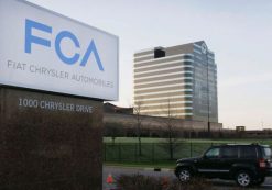 In this photo taken on Tuesday, May 6, 2014, a vehicle drives past a sign outside the Fiat Chrysler Automobiles world headquarters in Auburn Hills, Michigan. (Photo: AP)