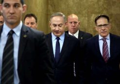 Israeli Prime Minister Benjamin Netanyahu, center, arrives for a weekly cabinet meeting, in Jerusalem, Sunday, Jan. 1, 2017. (Photo: AP)