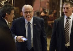 Former New York Mayor Rudy Giuliani, center, smiles as he leaves Trump Tower, Friday, Nov. 11, 2016, in New York. (Photo: AP)