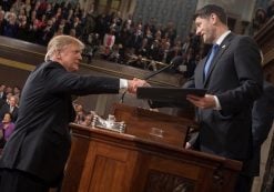 President Donald J. Trump, left, shakes hands with House Speaker Paul Ryan, R-Wis., right, before his address to a joint session of Congress.