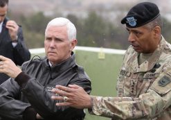 Vice President Mike Pence is briefed by Gen. Vincent Brooks, commander of the United Nations Command, U.S. Forces Korea and Combined Forces Command, from Observation Post Ouellette in the demilitarized zone (DMZ), near the border village of Panmunjom, South Korea, on Monday. (Photo: AP)