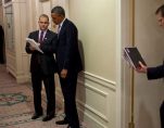 Barack Obama, center, talks with advisor Ben Rhodes, to his right, at the White House. (Photo: Reuters)