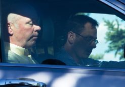 Montana Republican candidate Greg Gianforte sits in a car.