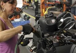 A worker installs parts onto the dashboard for the new Chevrolet Cruze car as it moves along the assembly line at the General Motors Cruze assembly plant in Lordstown, Ohio July 22, 2011. (Photo: Reuters)