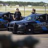 PHOTO: Burton Police Officers gather at Bishop International Airport, June 21, 2017. (Photo: AP)