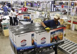 A worker stacks boxes of television sets after they have been assembled, checked and repackaged, before moving them to the warehouse at Element Electronics in Winnsboro, South Carolina May 29, 2014. (Photo: Reuters)