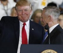 President Donald Trump left, waves to the crowd as he is introduced by Defense Secretary James Mattis, right, aboard the nuclear aircraft carrier USS Gerald R. Ford for it's commissioning at Naval Station Norfolk in Norfolk, Va., Saturday, July 22, 2017. (Photo: AP)