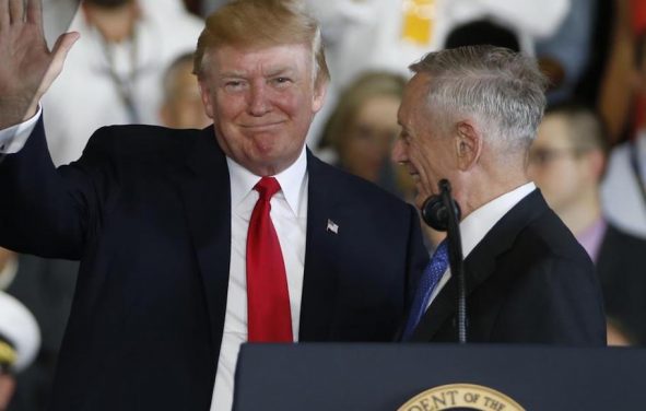 President Donald Trump left, waves to the crowd as he is introduced by Defense Secretary James Mattis, right, aboard the nuclear aircraft carrier USS Gerald R. Ford for it's commissioning at Naval Station Norfolk in Norfolk, Va., Saturday, July 22, 2017. (Photo: AP)