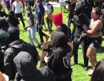 Antifa, otherwise known as so-called anti-fascists, attack journalists outside Martin Luther King Jr. Civic Center Park in Berkeley, California, on Sunday, August 27th, 2017.