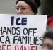 In this Feb. 17, 2017, photo, a protester holds a sign that reads 