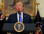 President Donald J. Trump, center, announces his support for the RAISE Act, flanked by Sens. Tom Cotton, R-Ark., left, and David Perdue, R-Ga., who first introduced similiar legislation. (Photo: Reuters)