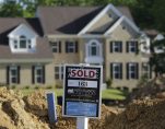 A completed house (rear) is seen behind the earthworks of a home currently under construction at the Mid-Atlantic Builder's 'The Villages of Savannah' development site in Brandywine, Maryland May 31, 2013. (Photo: Reuters)