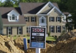 A completed house (rear) is seen behind the earthworks of a home currently under construction at the Mid-Atlantic Builder's 'The Villages of Savannah' development site in Brandywine, Maryland May 31, 2013. (Photo: Reuters)