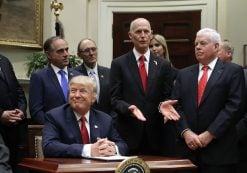 Florida Gov. Rick Scott, center, delivers brief remarks after President Donald J. Trump signed the Veterans Choice Program And Improvement Act with representatives of veterans’ organizations, politicians and members of his administration, including Veterans Affairs Secretary David Shulkin, in the Roosevelt Room at the White House on Wednesday in Washington, DC. (Photo: Reuters)