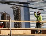 Men work on a construction site for a luxury apartment complex in downtown Los Angeles, California March 17, 2015. (Photo: Reuters)