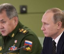 Russian President Vladimir Putin, right, with Defence Minister Sergei Shoigu, left, attend a meeting on Russian air force's activity in Syria at the national defense control center in Moscow, Russia, November 17, 2015. (Photo: Reuters)