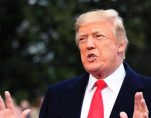 President Donald Trump speaks to reporters before leaving the White House in Washington, Friday, Dec. 15, 2017, for a trip to Quantico, Va., to attend the FBI National Academy graduation ceremony. (Photo: AP)