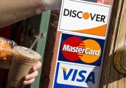 A coffee shop displays signs for Visa, MasterCard and Discover, in Washington, May 1, 2013. (Photo: Reuters)