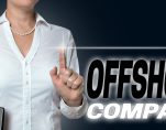 Offshore company touchscreen is operated by businesswoman background. (Photo: AdobeStock/wsf-f)