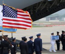 A U.N. honor guard carries a casket containing remains believed to be from American servicemen killed during the 1950-53 Korean War after arriving from North Korea, at Osan Air Base in Pyeongtaek, South Korea, on July 27, 2018. (Photo: AP)