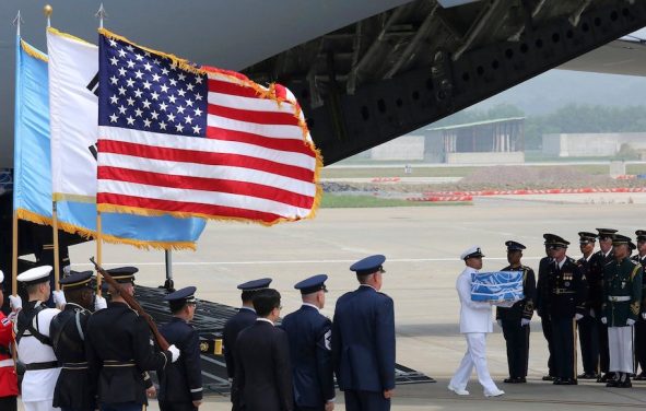 A U.N. honor guard carries a casket containing remains believed to be from American servicemen killed during the 1950-53 Korean War after arriving from North Korea, at Osan Air Base in Pyeongtaek, South Korea, on July 27, 2018. (Photo: AP)