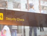 Double exposure of security check airport sign. Airport security check at gates with metal detector and scanner. (Photo: AdobeStock)