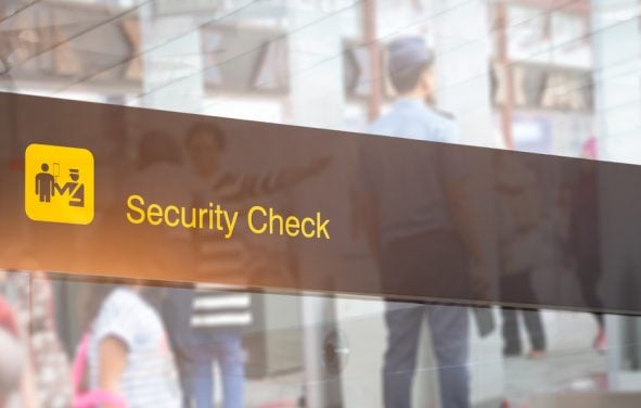 Double exposure of security check airport sign. Airport security check at gates with metal detector and scanner. (Photo: AdobeStock)