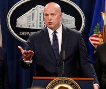 Acting Attorney General Matthew Whitaker, center, FBI Director Christopher Wray, right, and Commerce Secretary Wilbur Ross, left, announce indictments against Chinese telecommunications conglomerate Huawei. (Photo: Screenshot)