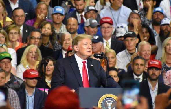 President Donald Trump jokes with the crowd President Donald Trump touts record low unemployment for minorities during a rally in Tampa, Florida on Tuesday, July 31, 2018. (Photo: Laura Baris/People's Pundit Daily)