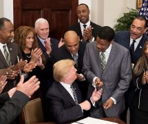 Donald Trump hands a pen to Isaac Newton Farris Jr. after signing a proclamation in honor of Martin Luther King Jr. Day. January 2018. (Photo: Official White House)