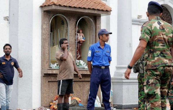 People gather outside St. Anthony's Shrine where a blast happened, in Colombo, Sri Lanka, Sunday, April 21, 2019. (Associated Press)