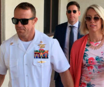 U.S. Navy SEAL Chief Edward Gallagher, left, and his wife, Andrea Gallagher arrive at military court Monday.