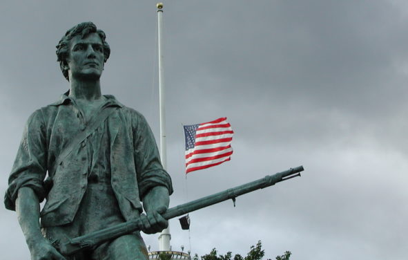 Summer's End. Lexington Green, 11 September 2002. Photo taken in Minute Man National Historical Park, with flag at half staff on the first anniversary of the terrorist attacks of 11 September 2001. Sculpture : 