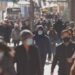 Crowd of people walking the city streets while wearing masks during the coronavirus (Covid-19) pandemic. (Photo: AdobeStock)